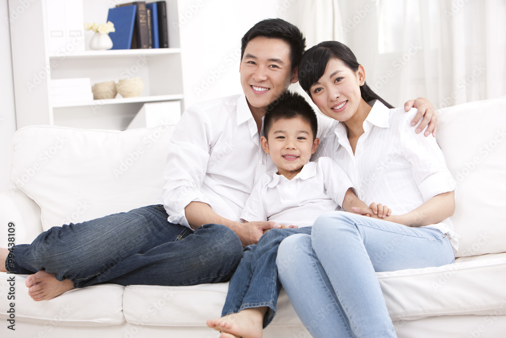 Happy family sitting in sofa