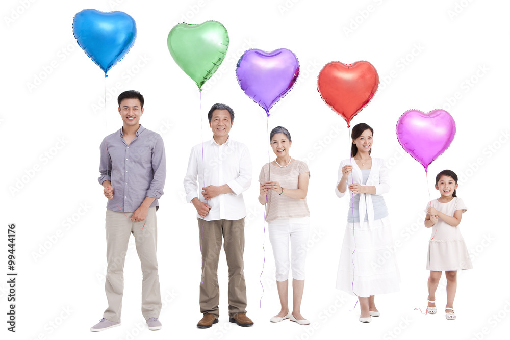 Family holding heart-shaped balloons