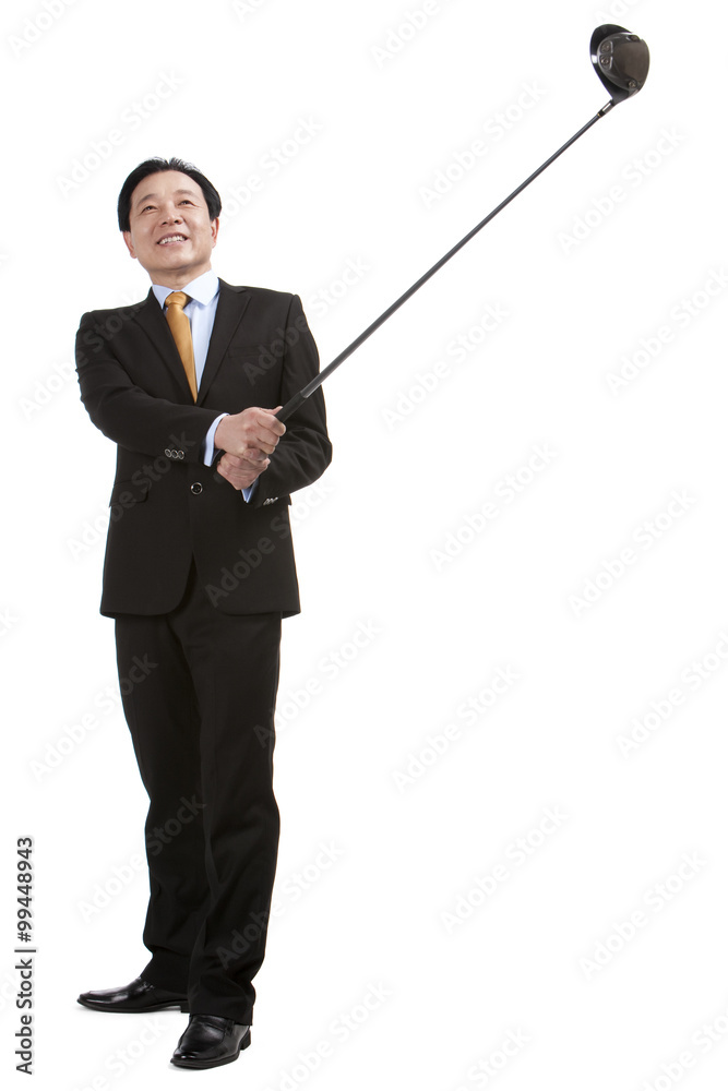 Businessman playing golf