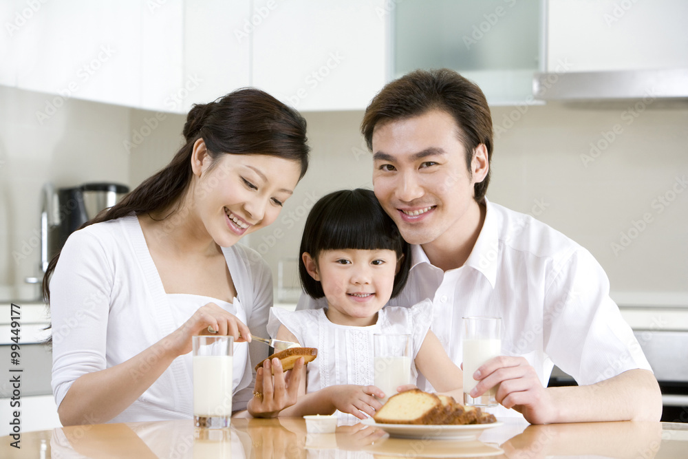 Portrait of a family eating breakfast