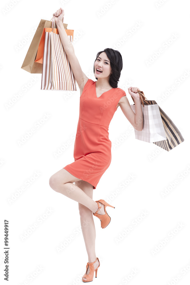 Happy young woman with shopping bags