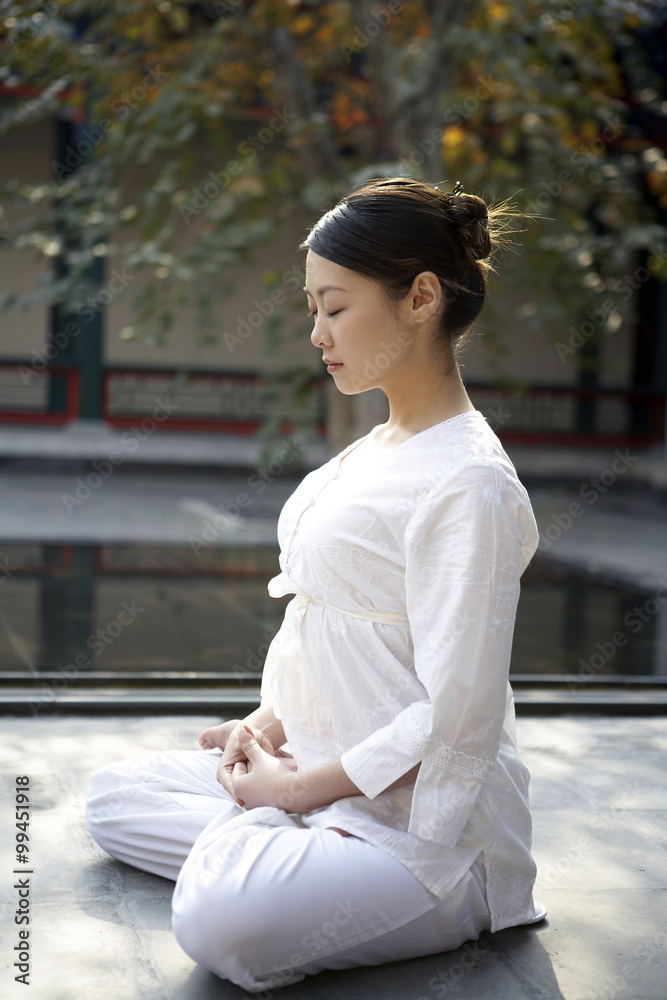 Woman Meditating Outdoors