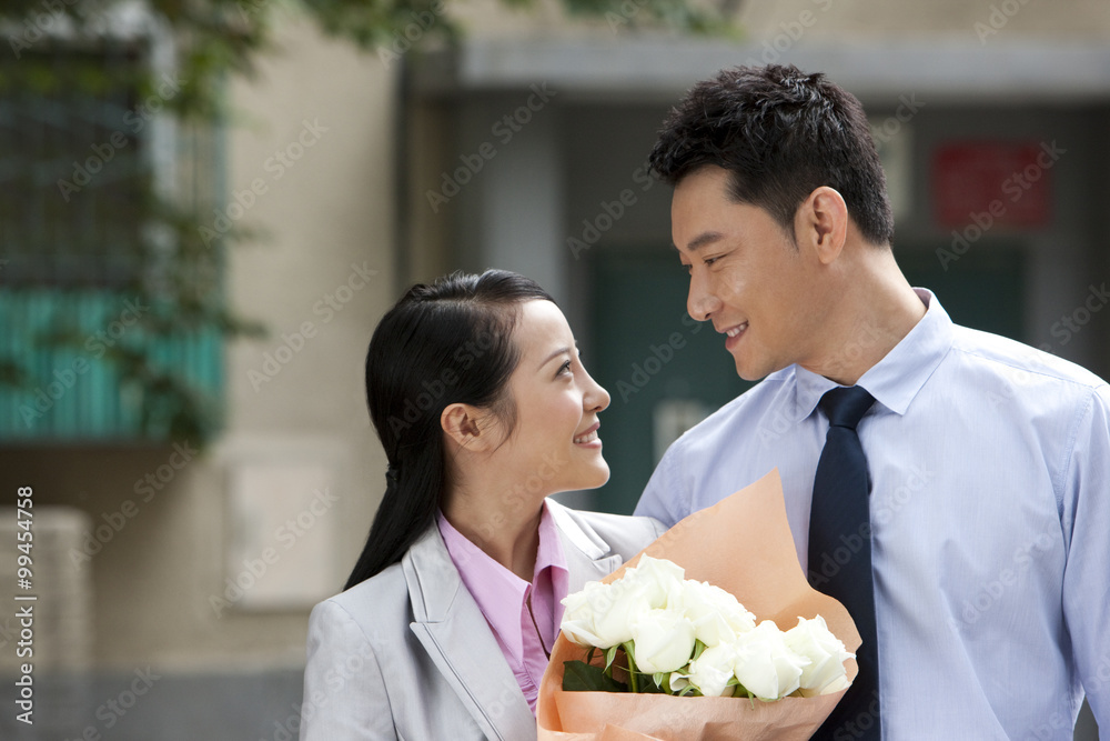 White-collared couple coming home from work