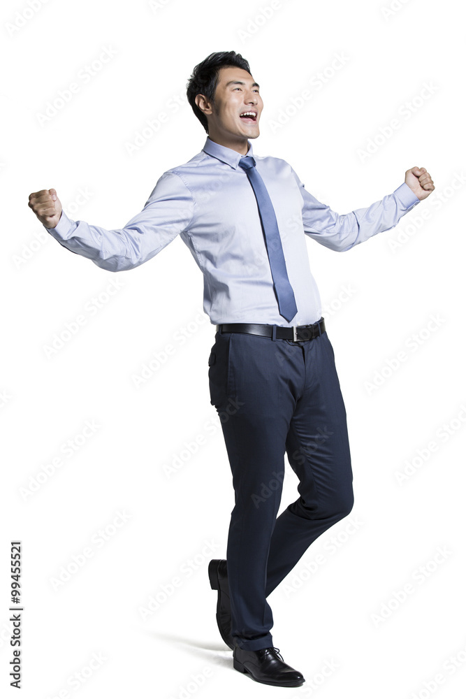 Young businessman cheering