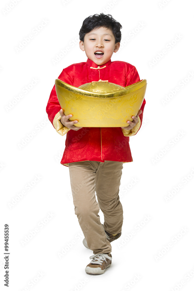 Happy boy holding a large Chinese traditional currency yuanbao