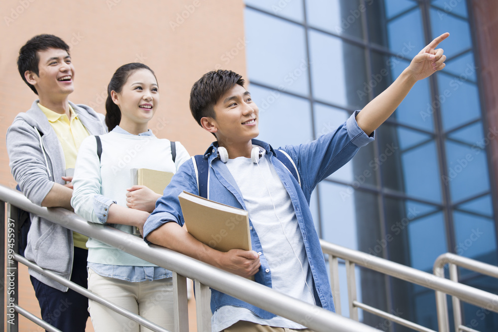 Young college students outside library