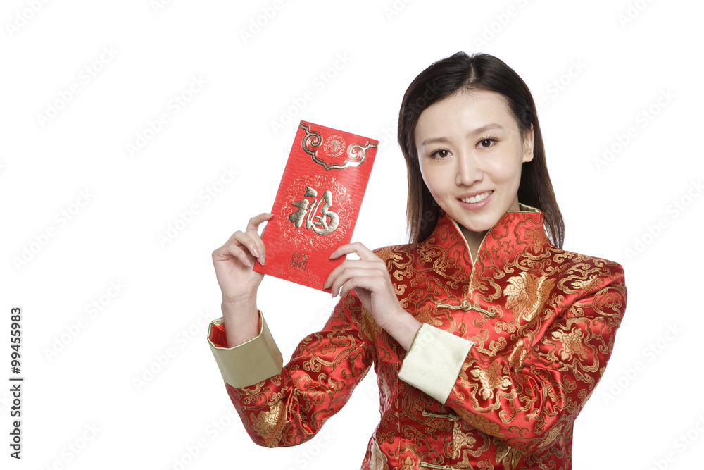 Young woman in Chinese traditional clothes holding red envelope