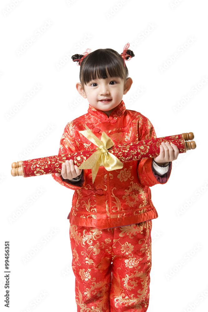 Young girl in Chinese traditional clothes holding scroll   