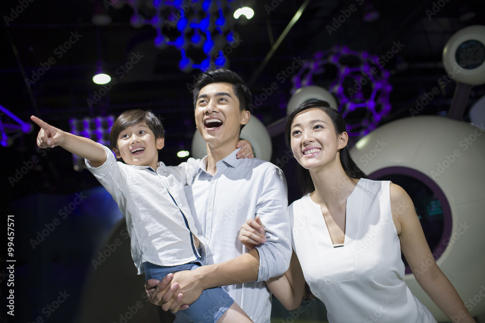 Young family in science and technology museum