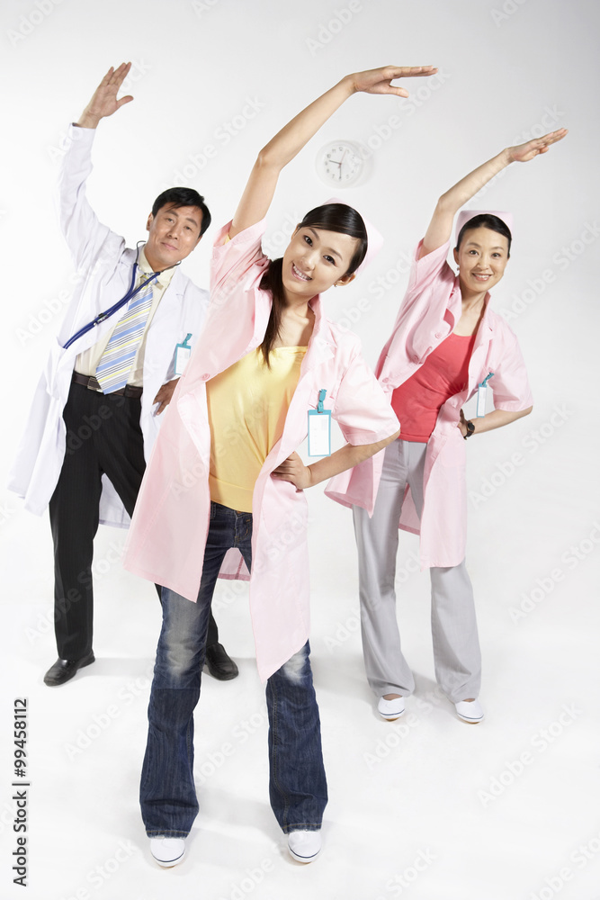 Nurses And Doctor Stretching To One Side