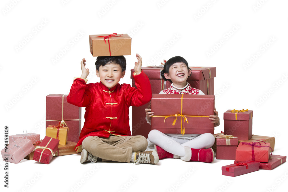 Happy children receiving many Chinese new year gifts