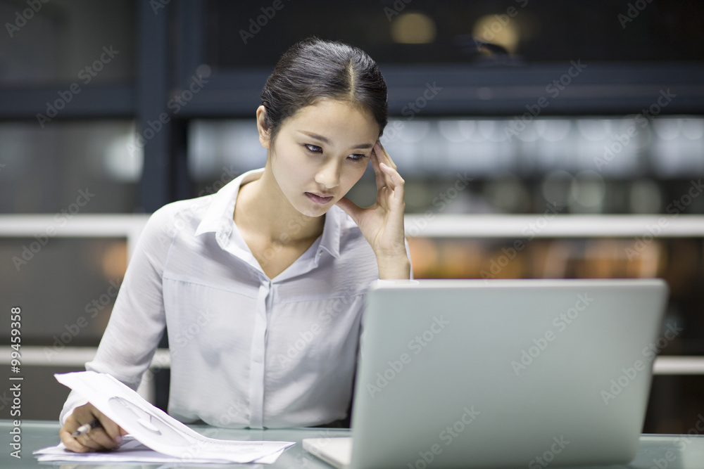 Young businesswoman working in office