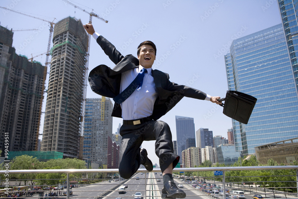 Happy businessman in an urban scene