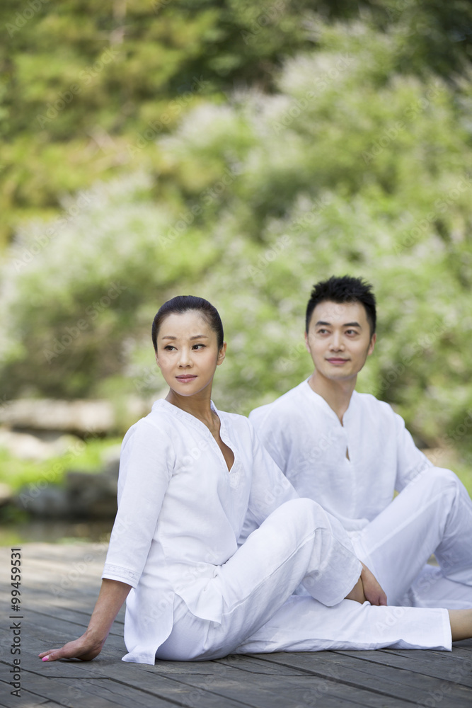 Young adult practicing yoga