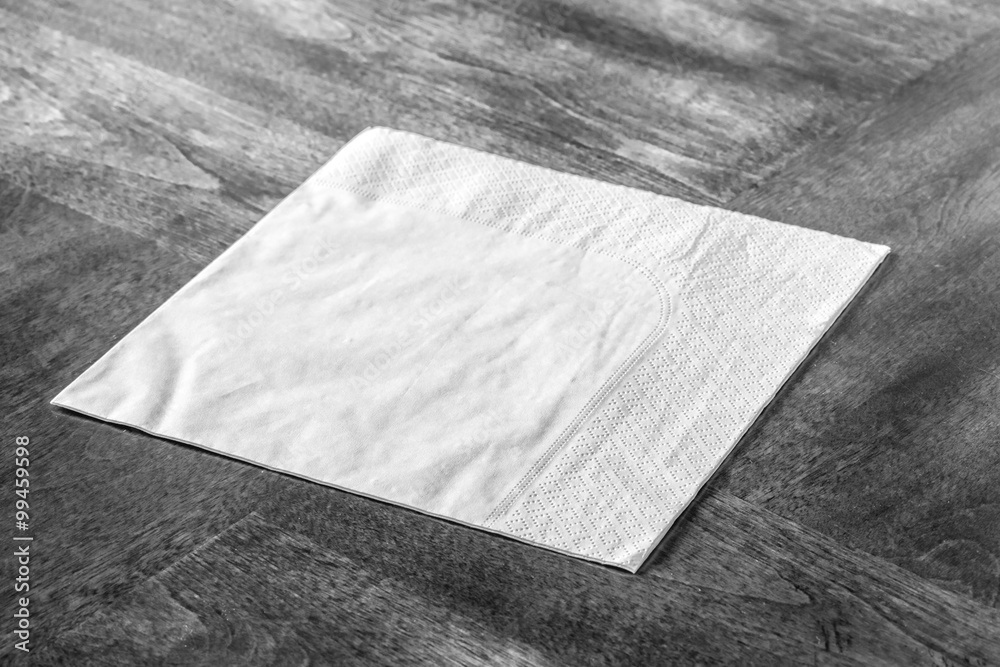 Paper napkin on wooden table