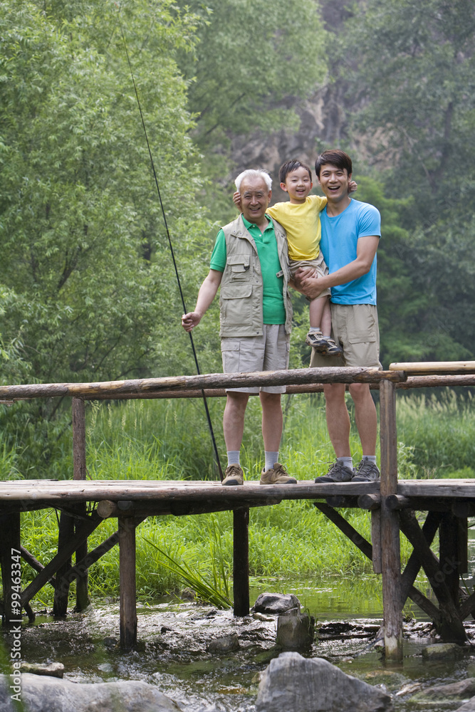 Portrait of three generations fishing