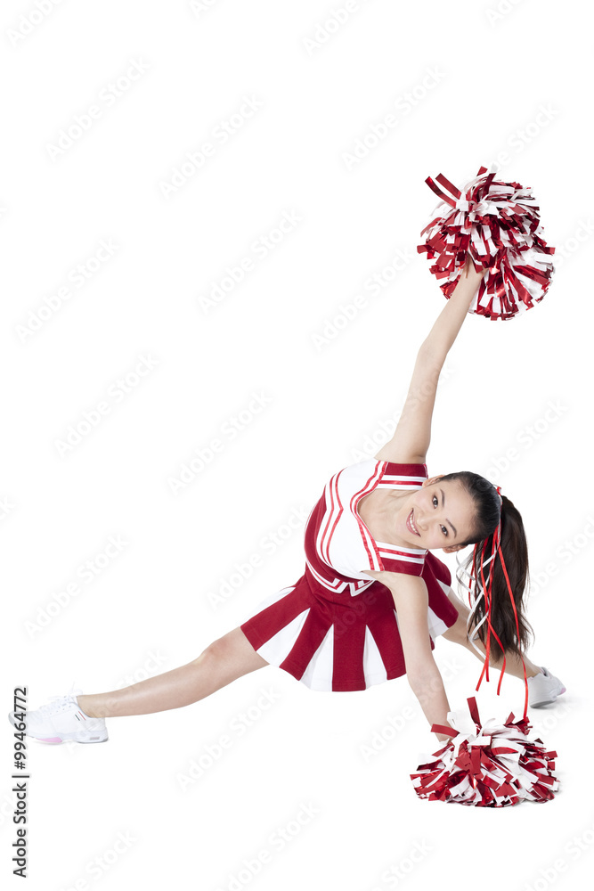 Cheerleader in action with her pom-poms