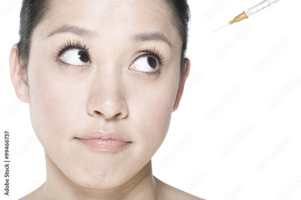 Young woman receiving Botox treatment