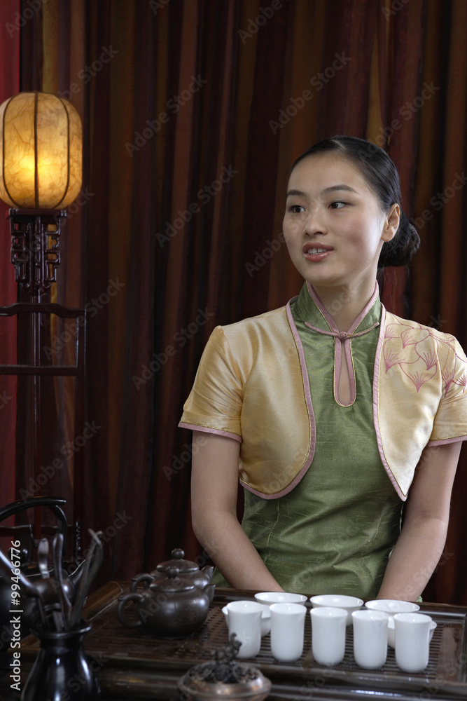 Waitress Serving Cups Of Tea