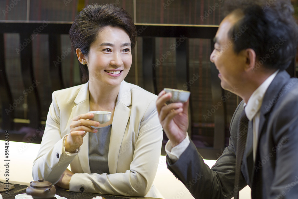 Business person drinking tea in tea room