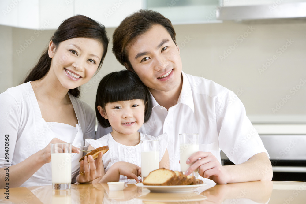 Portrait of a family eating breakfast