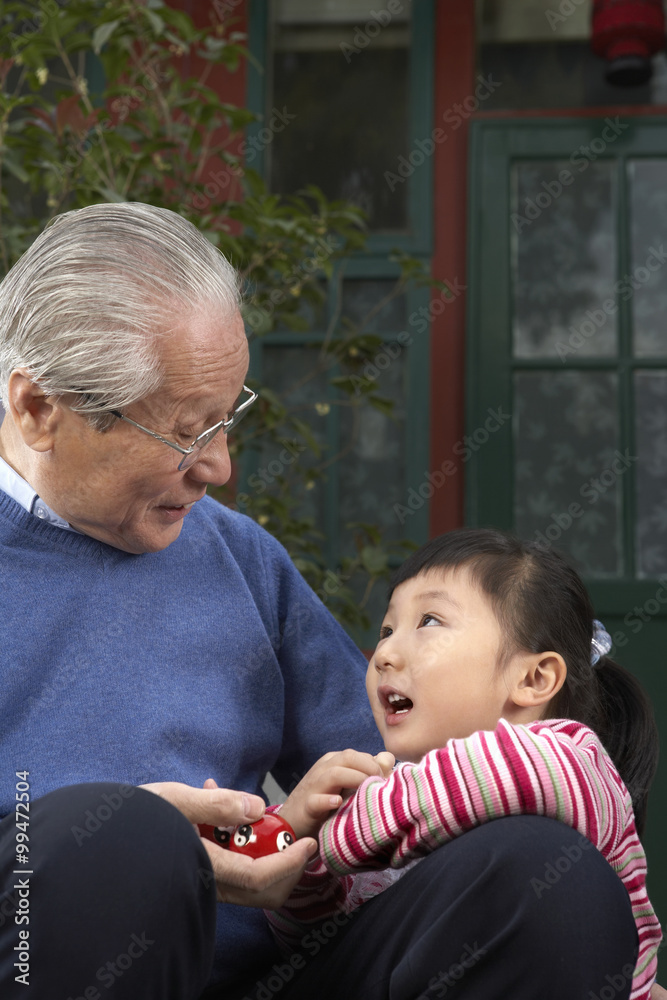 Grandfather And Daughter Looking At Each Other