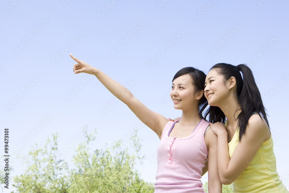 Portrait of two girlfriends at the park