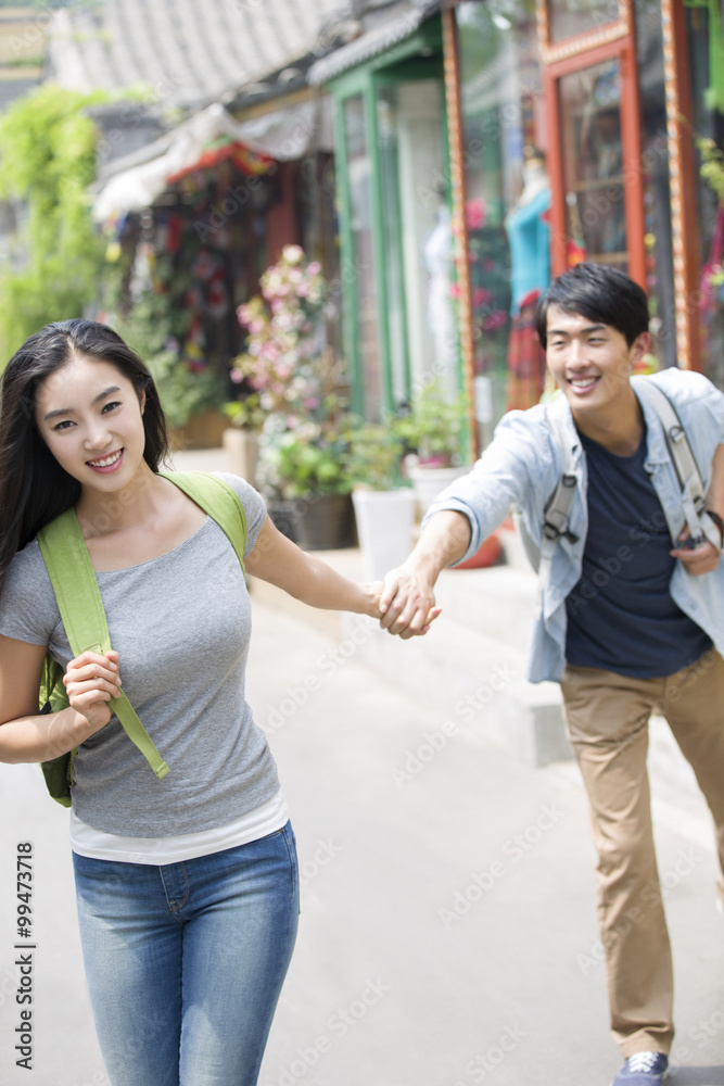 Young couple travelling in Beijing Hutong