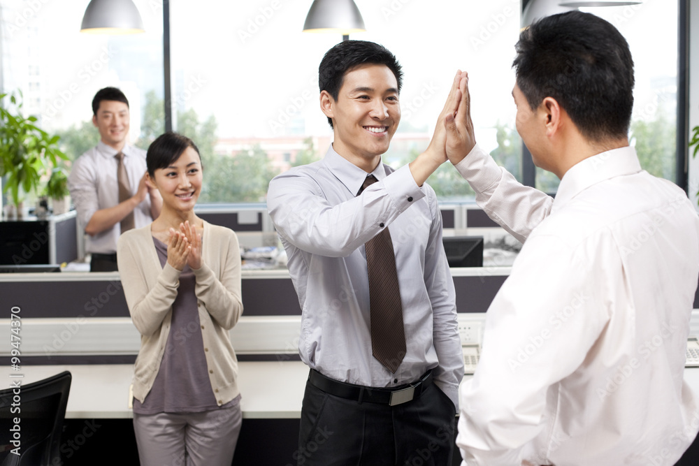 Office workers celebrating success