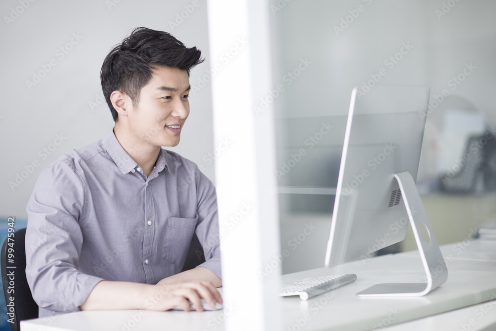 Young businessman working in office