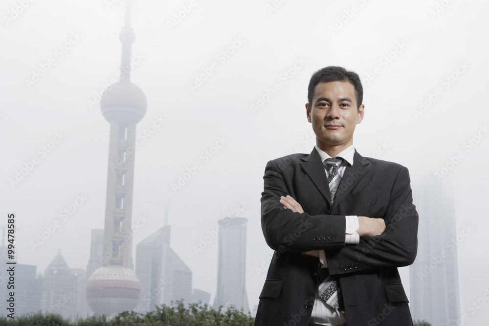 Businessman Standing In City Fog