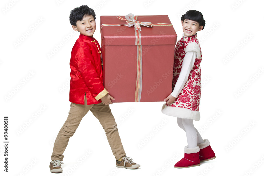 Happy children carrying a large Chinese new year gift