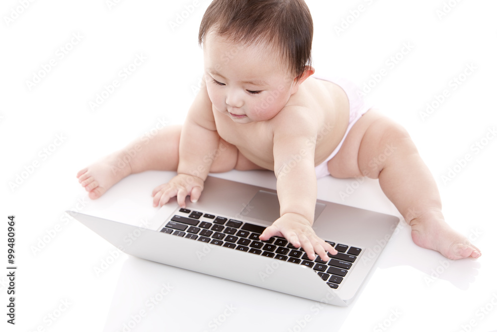 Cute baby girl with laptop