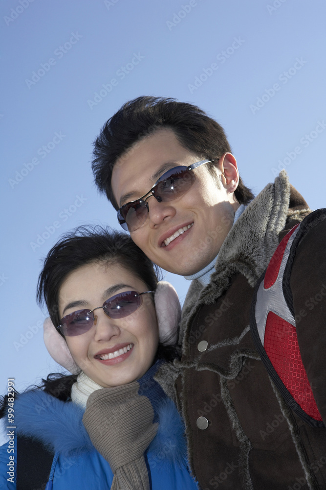 Couple Smiling, Looking Into The Distance