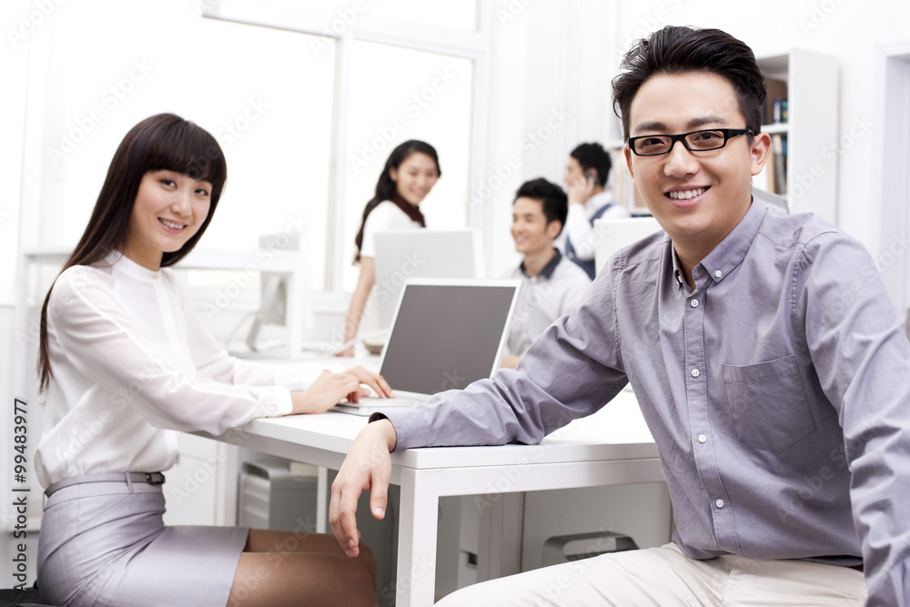 Cheerful office workers in studio