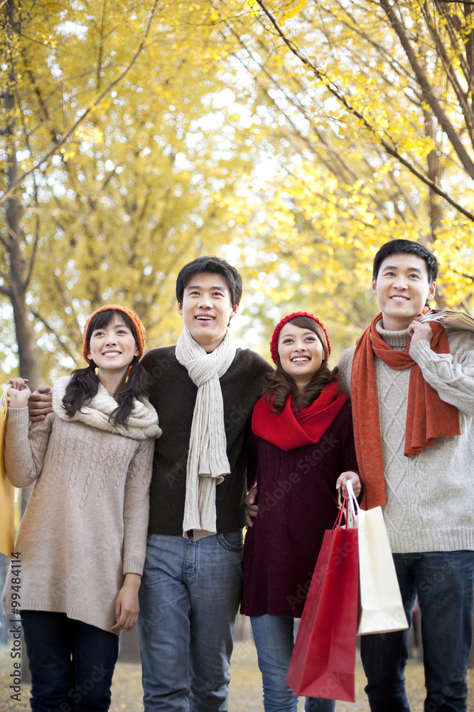 Friends in a Park with Shopping Bags