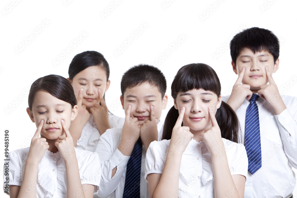 Portrait of schoolchildren doing eye exercises