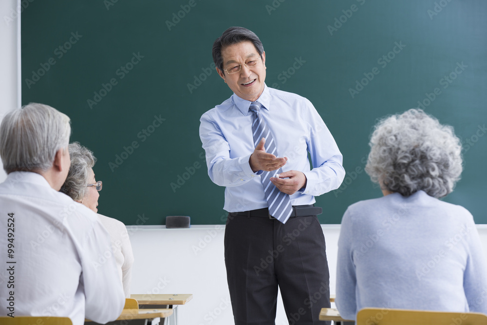 Teacher and students in university for the elderly