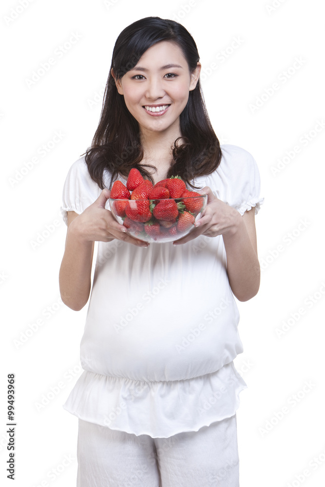 Pregnant woman with fresh strawberries