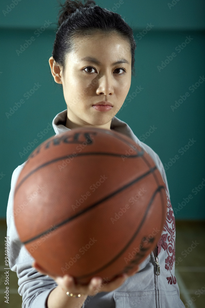 Teenage Girl Holding Basketball