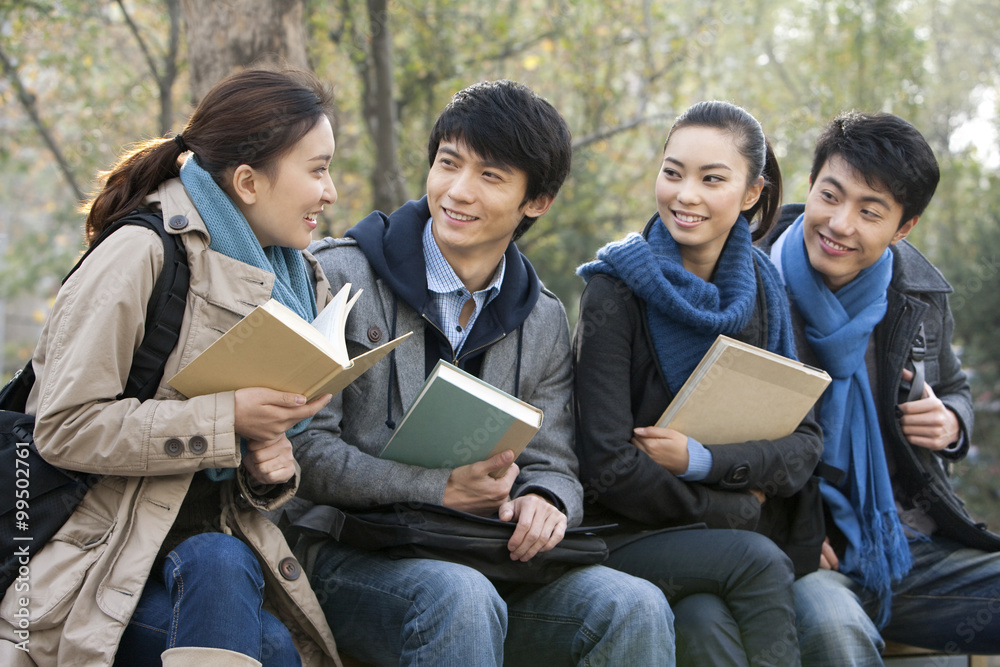 A group of college students talking with each other