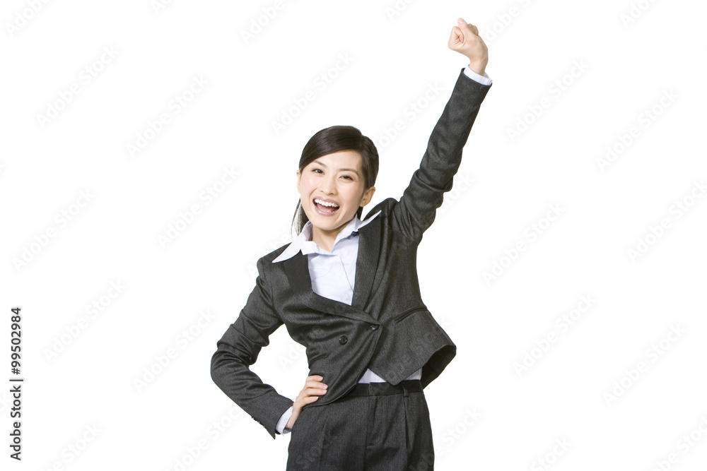 Excited businesswoman arms raised