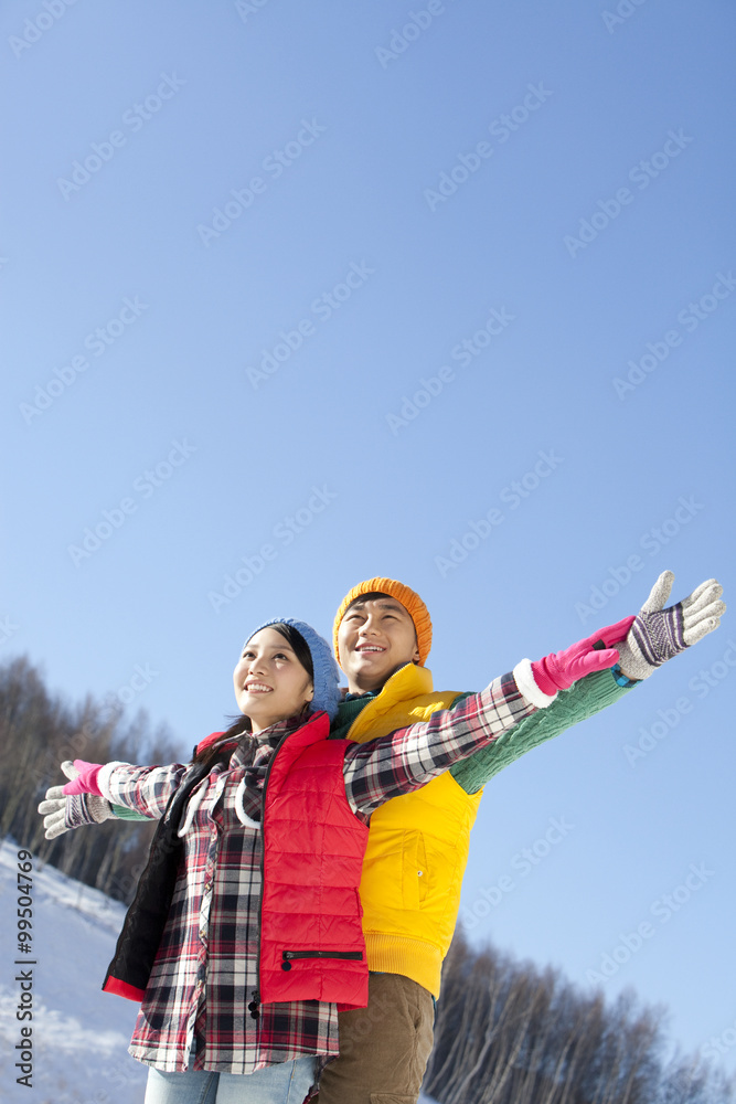 Happy young couple in ski resort