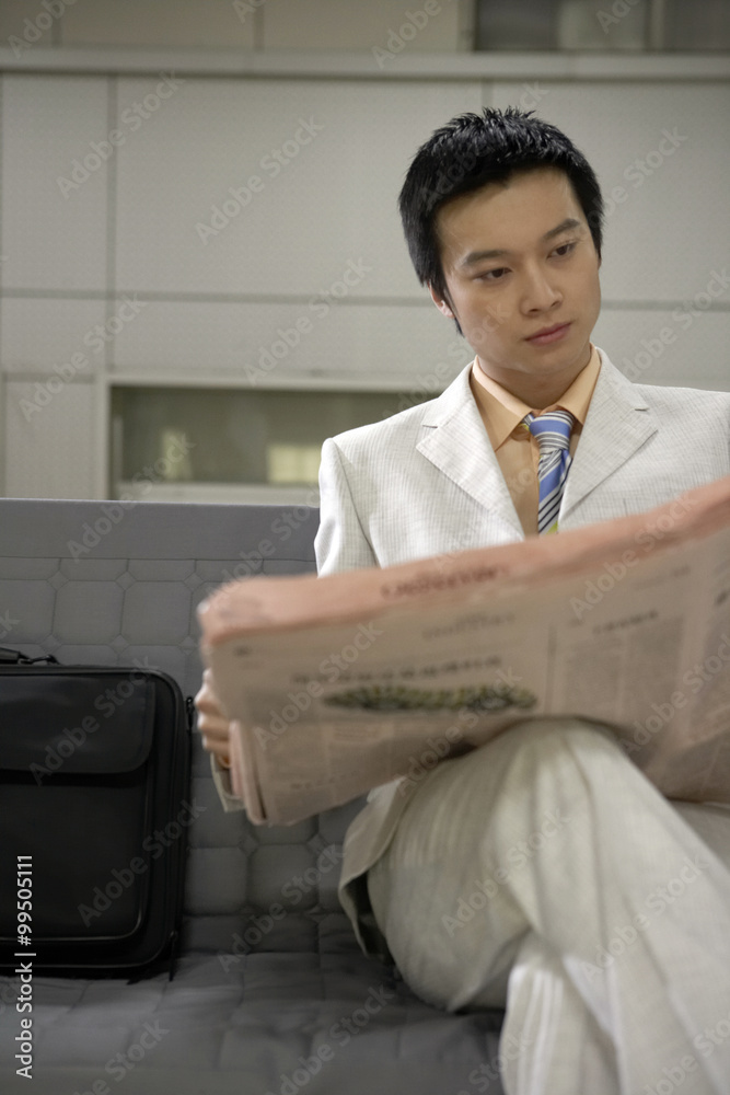 Man Reading Newspaper