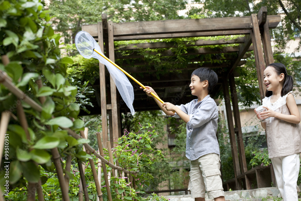 Chinese children playing in a garden