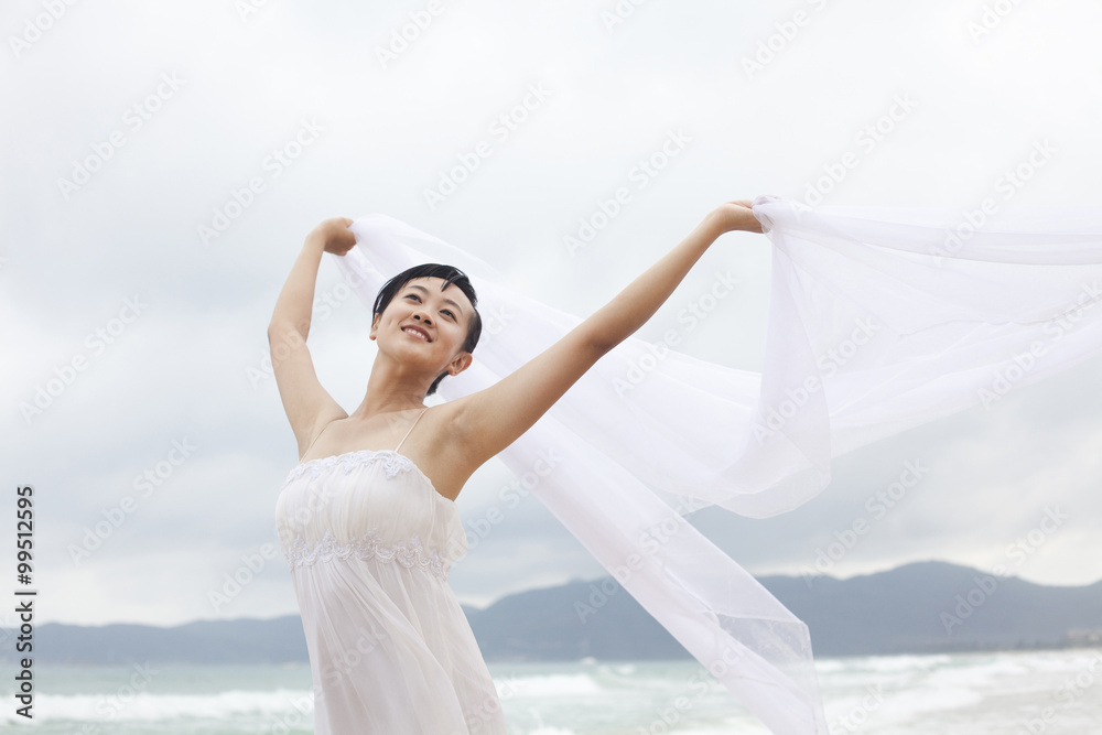 Portrait of young woman at the beach