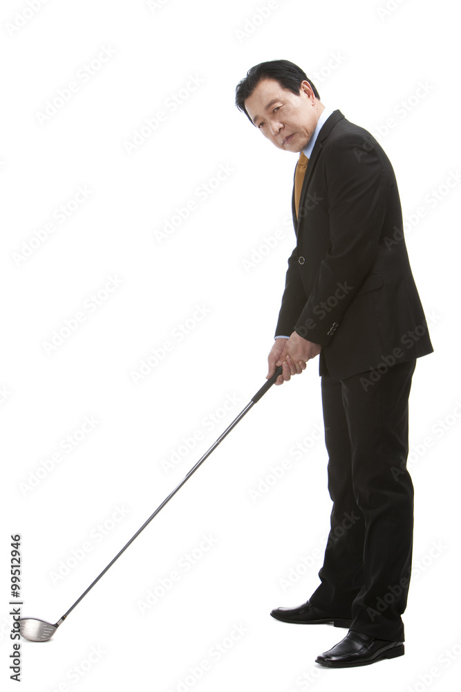 Businessman playing golf