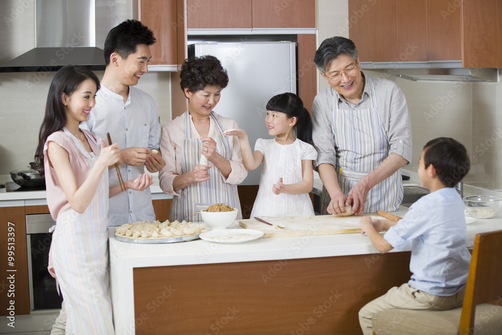 Happy family making dumplings