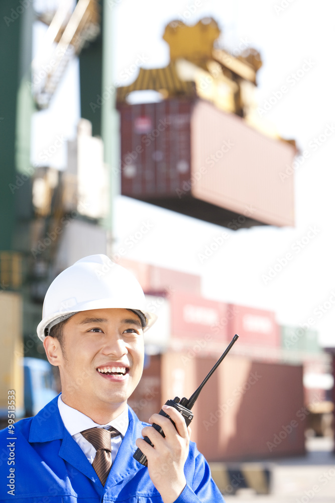 shipping industry manager with a walkie-talkie