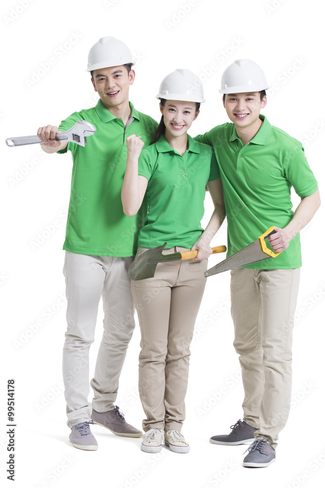 Happy volunteers with work tools